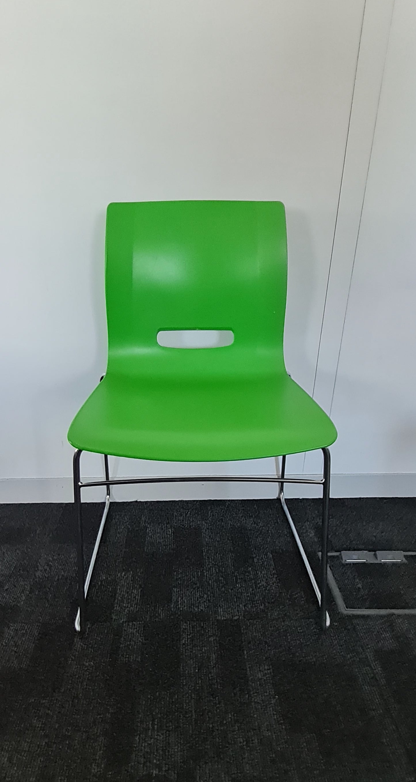 Green Senator dining chair on carpet