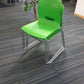 Green cantilever dining chairs stacked