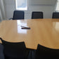 LARGE WOOD FINISH OFFICE CONFERENCE TABLE AND BLACK CHAIRS