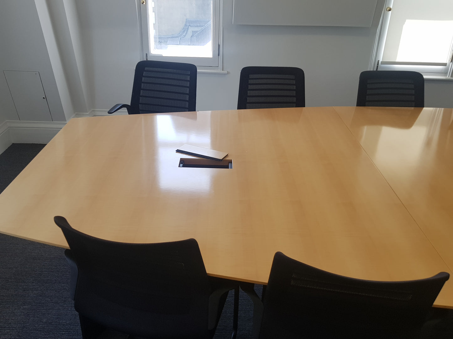 LARGE WOOD FINISH OFFICE CONFERENCE TABLE AND BLACK CHAIRS