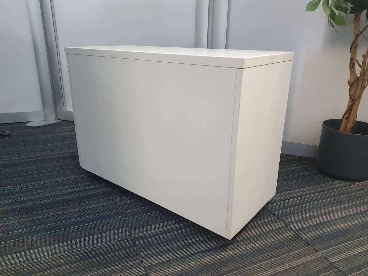 Side and back of light grey long slim office drawers