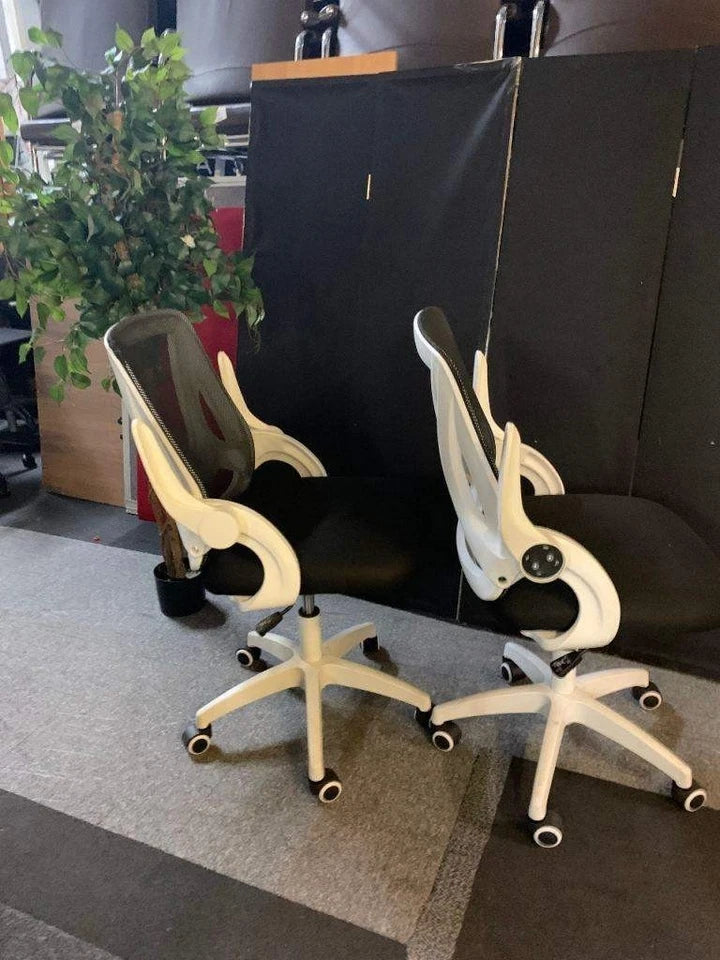 Used operator adjustable swivel chair Black and white contrast