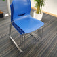 Blue cantilever dining chairs stacked