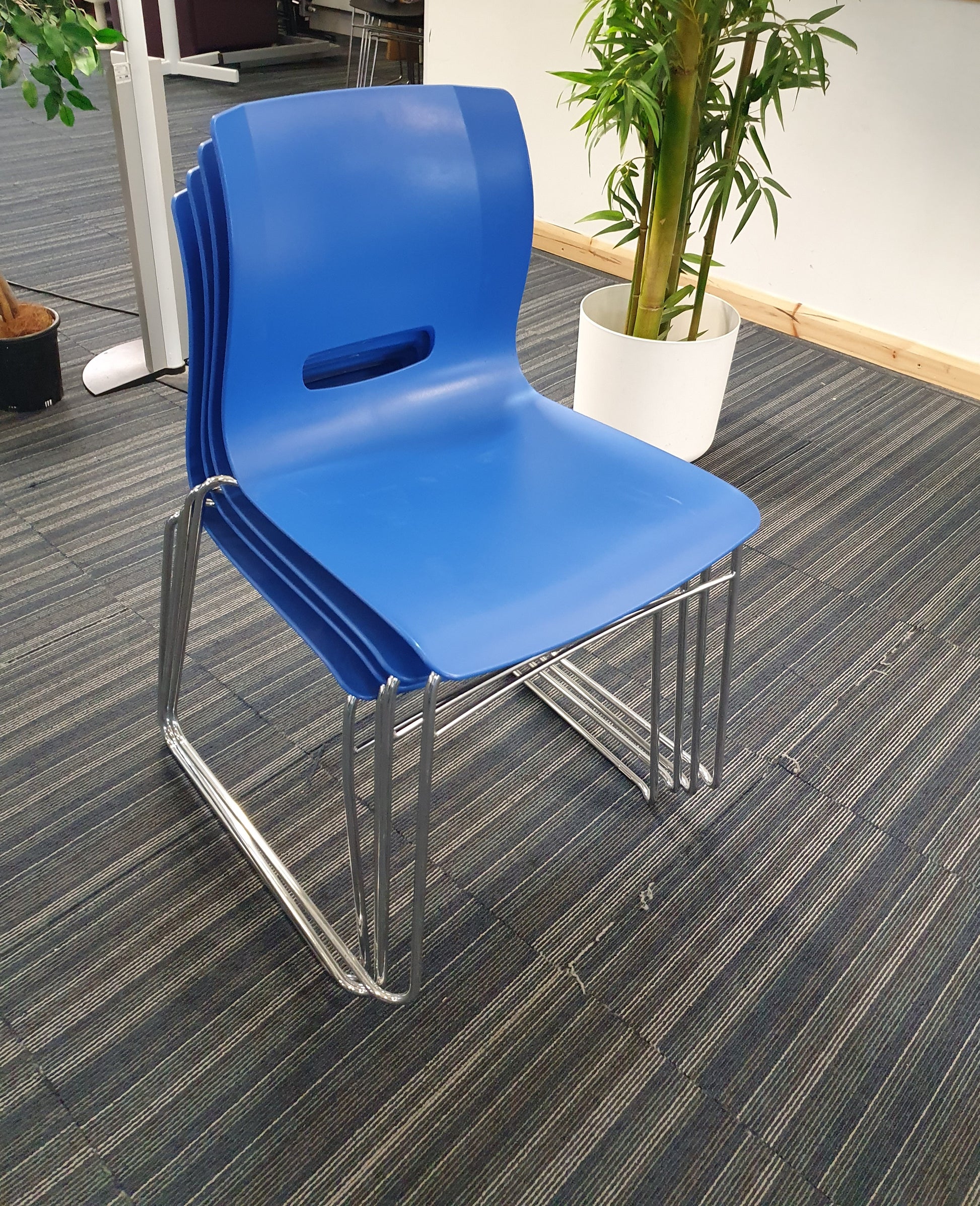 Blue cantilever dining chairs stacked