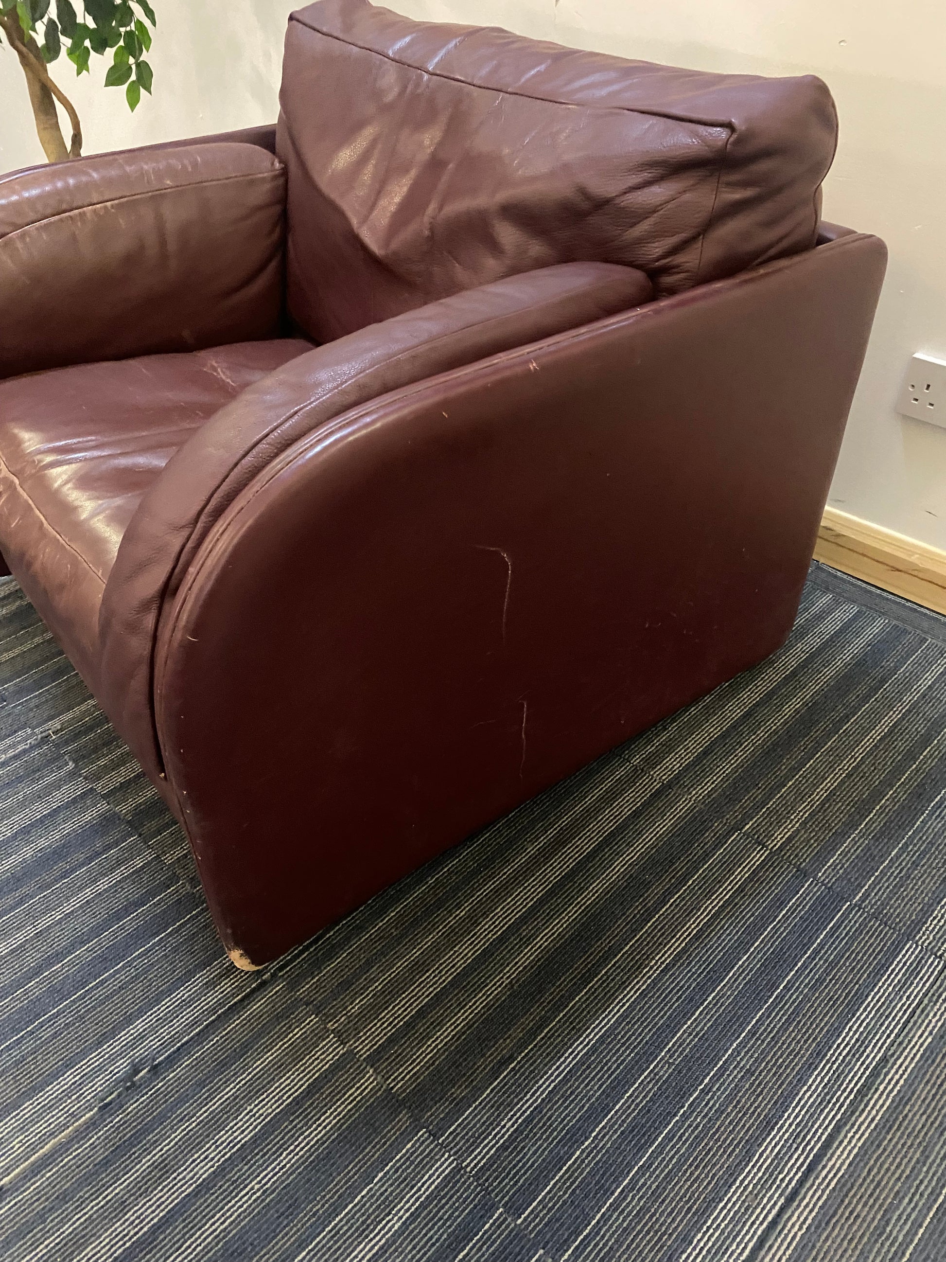 leather reception armchair sofa on carpet side profile