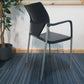 office meeting stick chair in black with armrests with plant on side