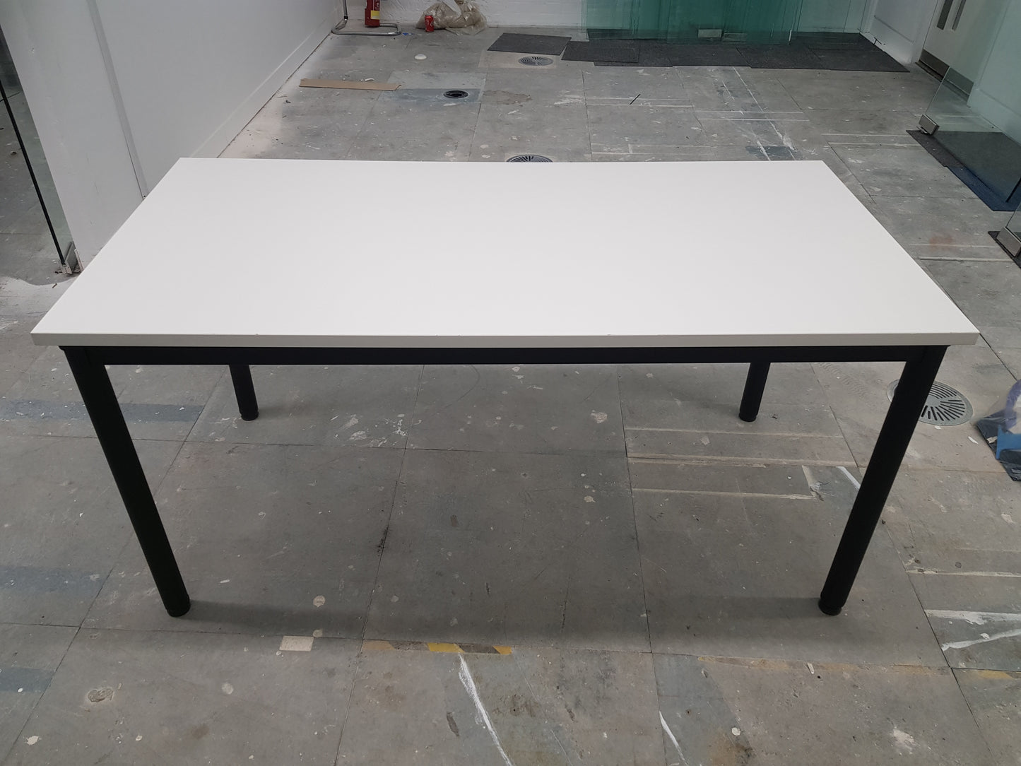 white folding office table with black legs