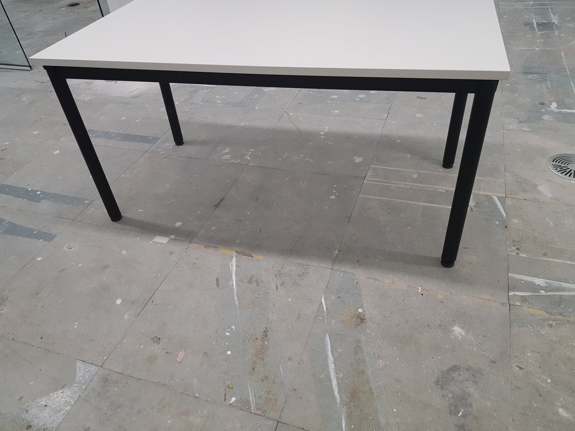 black legs of white folding foldable office table 