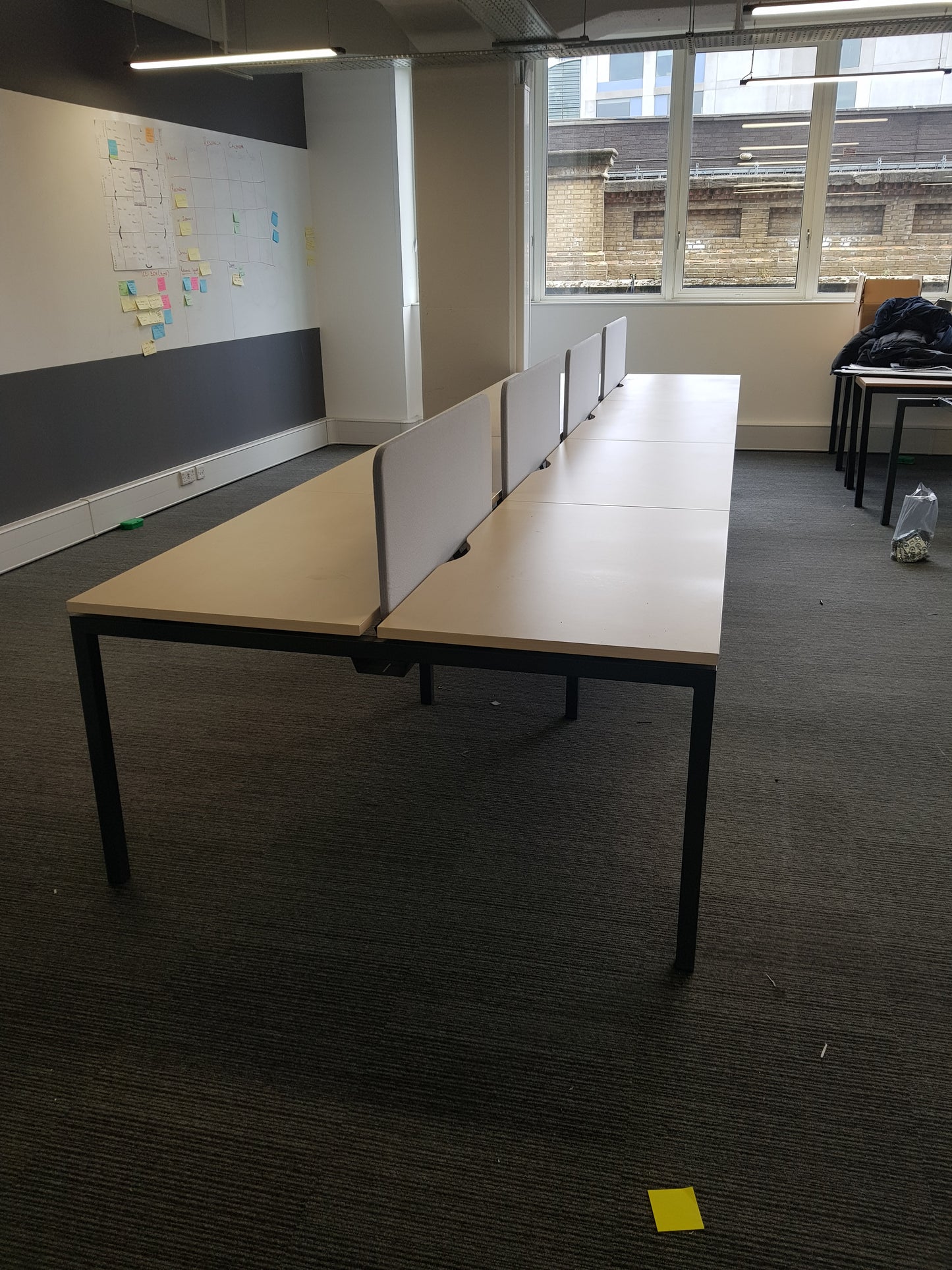 Eight person office bank of desks on whiteboard