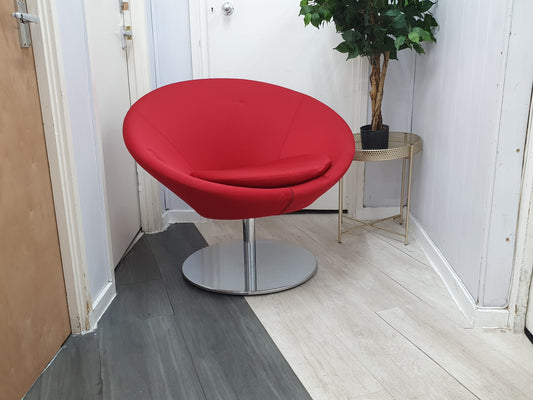 Centre, Red  Conic Lounge chair, right, plant on a round table