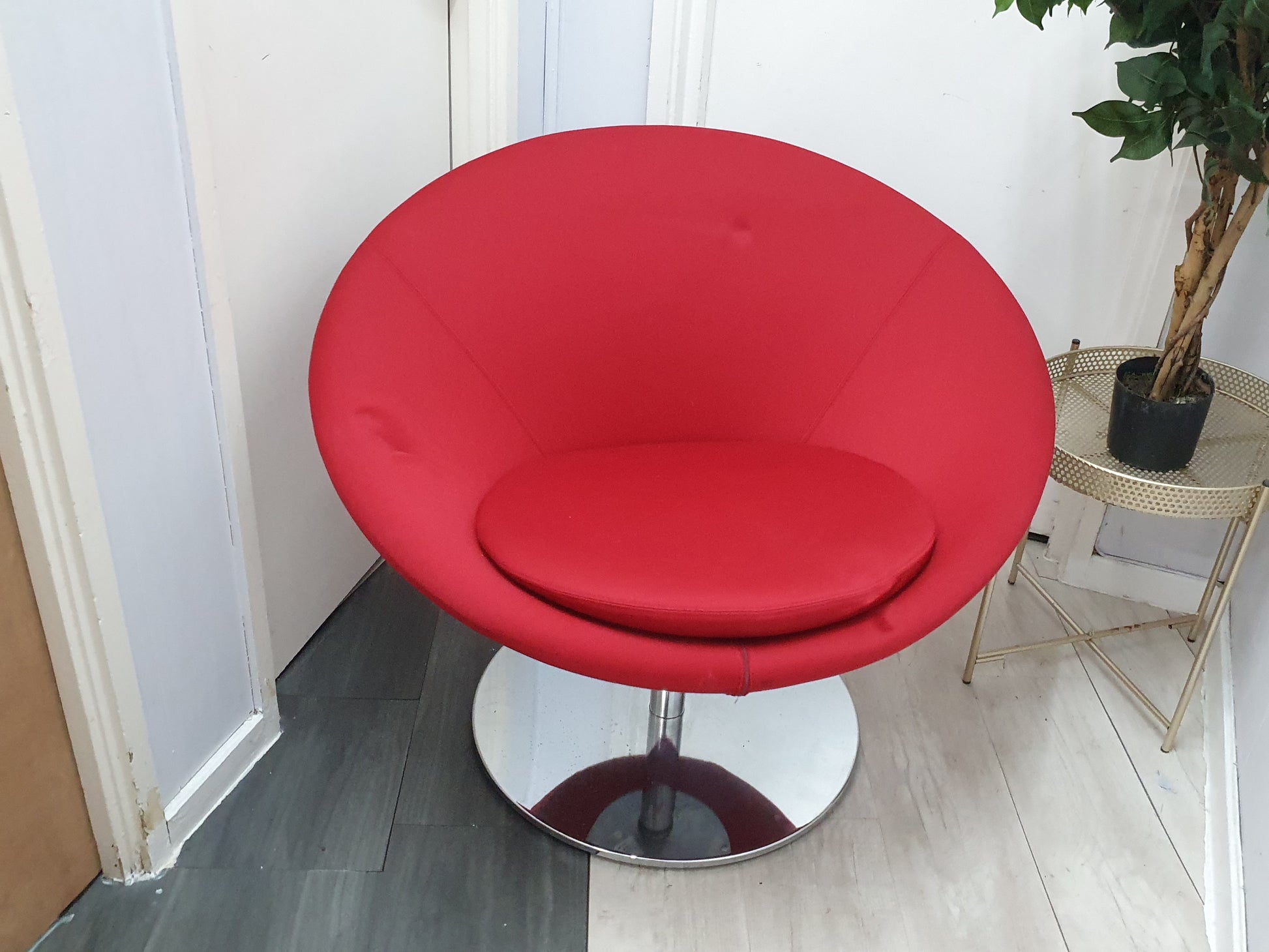 Centre, Red  Allermuir Conic Lounge chair, right, plant on a round table