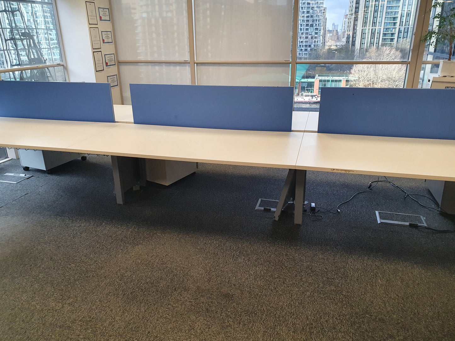 Six seater Bench desk with large window city view 