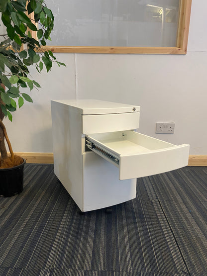 Left, tall green plant, centre, White filing drawer