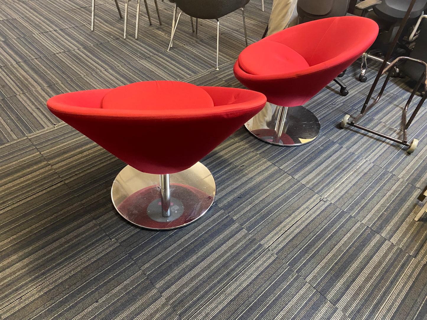 Two red large reception chairs