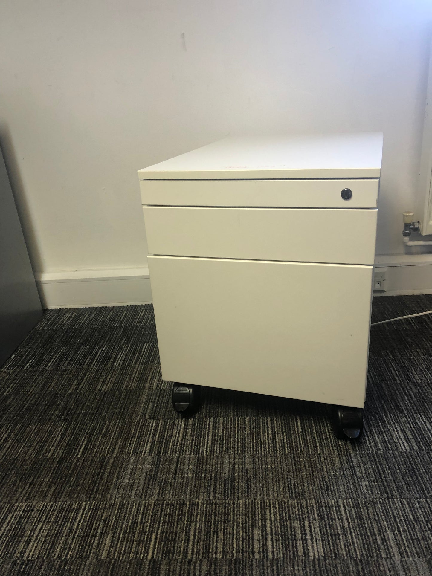 White mobile small cabinet on wheels